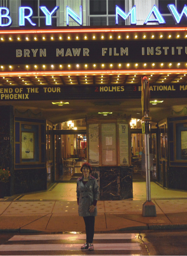Dr. Harriet Fields standing in front of Bryn Mawr Film Institute's marquee.